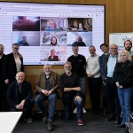 Photo of the AICE team in person and online